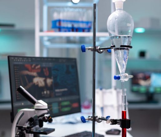 Science laboratory equipment and test tube with blood for healthcare development. Chemical dripping pipe with glass flask for analysis in biochemistry lab at clinic. Professional instruments